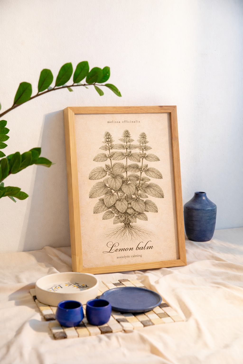 Vintage sepia medicinal herb poster featuring Lemon Balm (Melissa officinalis) as a detailed botanical illustration on aged paper, with a clear printed title and apothecary reference style.